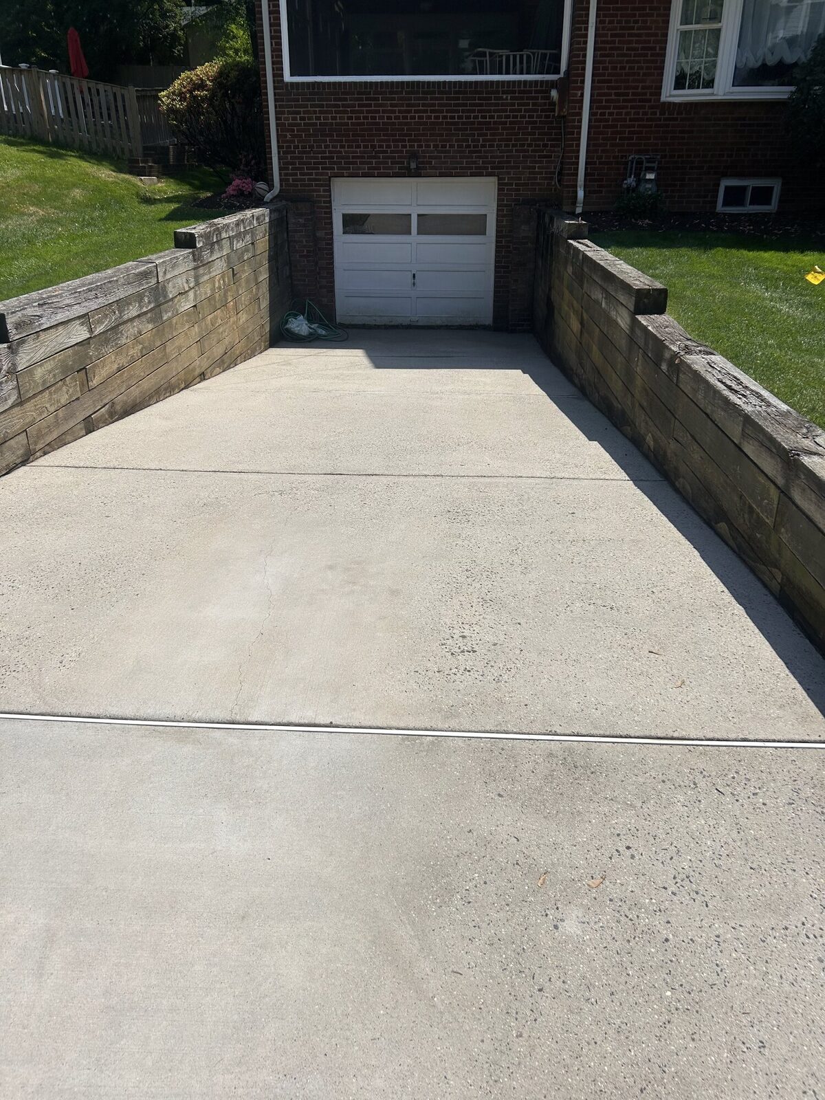 Driveway after power washing — clean concrete