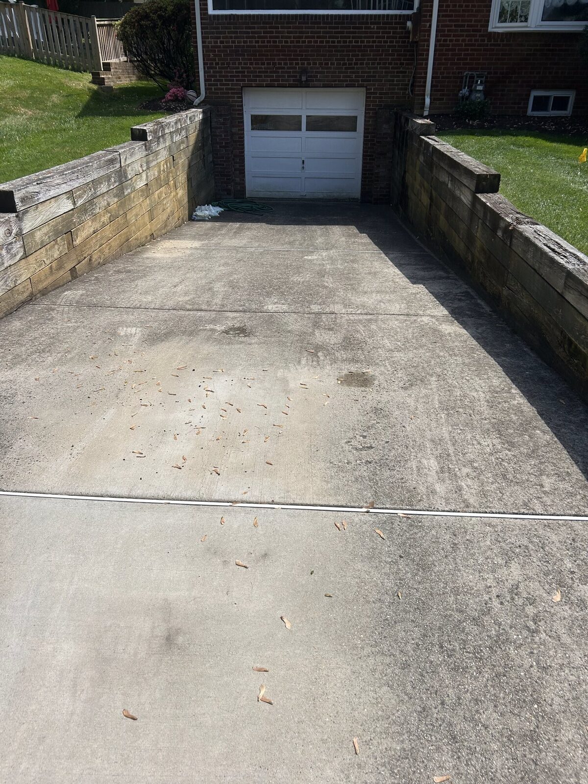 Driveway before power washing — stained concrete